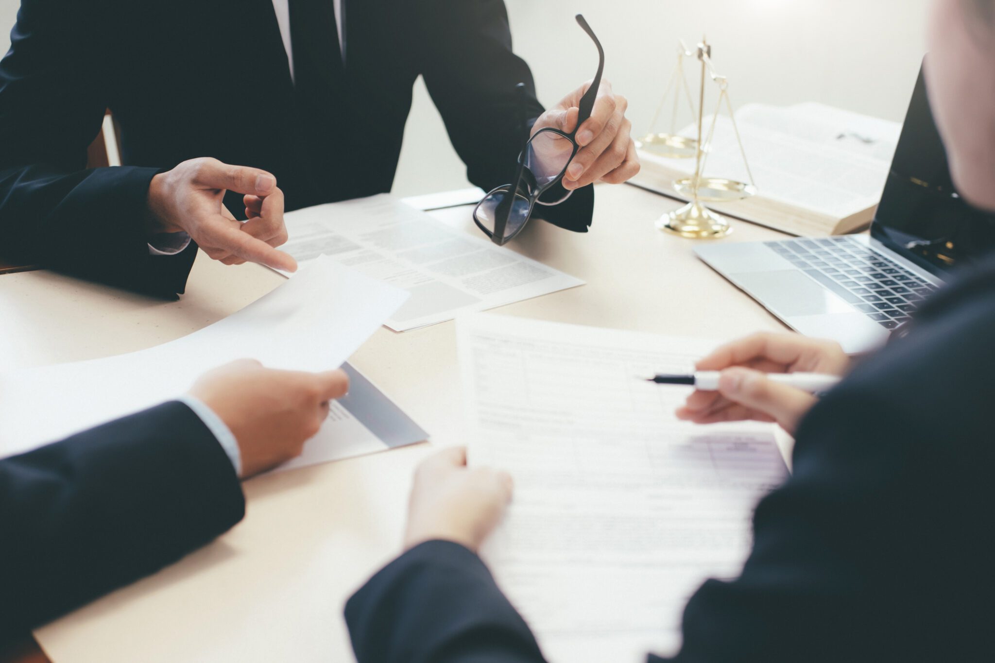 Law, advice and Legal services concept. Lawyer and attorney having team meeting at law firm. Law, advice and Legal services concept. Lawyer and attorney having team meeting at law firm.