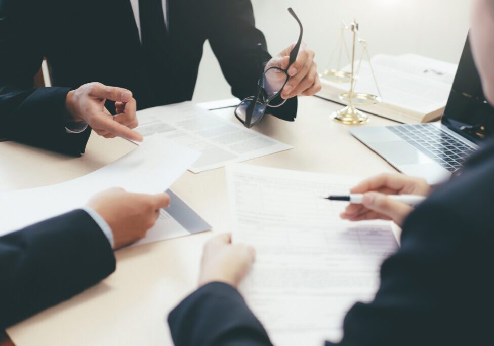 Law, advice and Legal services concept. Lawyer and attorney having team meeting at law firm.